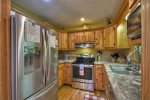 Kitchen with Stainless Electric Appliances and Granite Counter Tops 